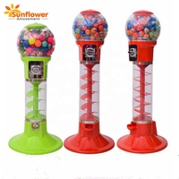 Machine distributrice de bonbons à la capsule, de balles et de barbes à papa, populaire auprès des enfants, pour parcs d'attractions