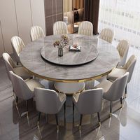 Ensemble de table à manger moderne en pierre frittée ronde avec plateau tournant et chaises rembourrées