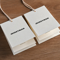 Étiquettes de vêtements pliées personnalisées avec impression de logo pour hommes et femmes
