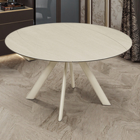 Table à manger ronde extensible moderne avec plateau en pierre frittée de travertin blanc et base de pieds crème, design minimaliste pour salle à manger à domicile