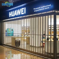 Vente en gros de porte électrique en alliage d'aluminium pour l'intérieur, avec volet roulant en cristal, porte coulissante pliable pour centre commercial, fabricant