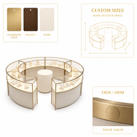 Vitrine de présentation de bijoux modulaire ronde personnalisée avec bordure dorée et vitrine incurvée en verre pour bijouterie
