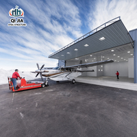 Hangar d'avion en structure acier de haute qualité, résistant aux charges de neige, préfabriqué avec porte hydraulique pliante