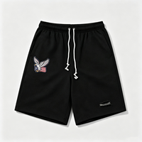 Shorts noirs déchirés avec broderie Aigle Américain et ourlet déchiré, pantalon décontracté streetwear d'été pour hommes