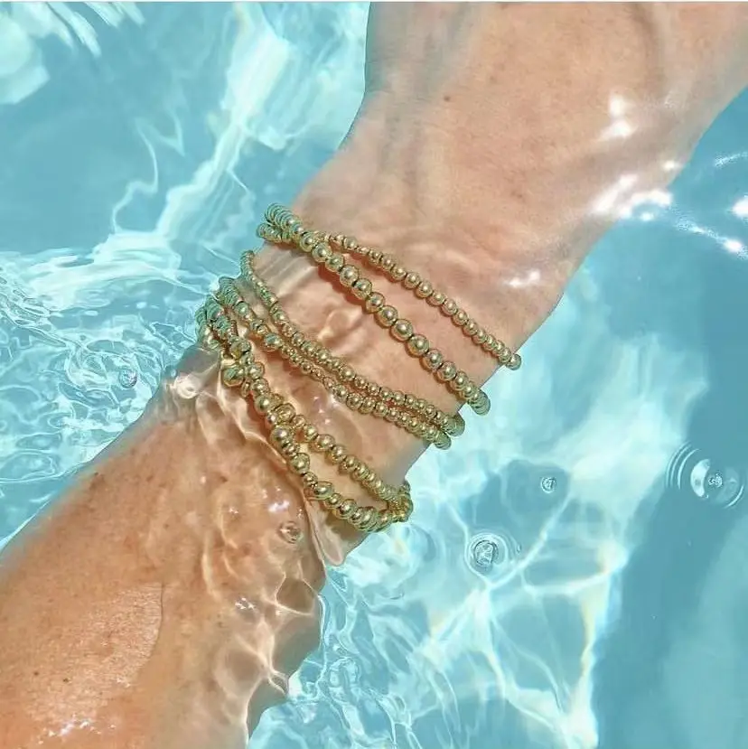 Braccialetti elastici elasticizzati avvolgenti con perline in acciaio inossidabile placcato oro moda all'ingrosso