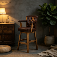 Tabouret de bar pivotant en cuir, dossier haut, capitonnage boutonné, garniture à clous en losange, accoudoirs, pieds en bois, style vintage pour bar, îlot de cuisine