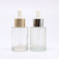 Flacon compte-gouttes en verre rond transparent à épaule plate de 20ML, 30ML, 40ML, 50ML pour cosmétiques avec bouchon doré
