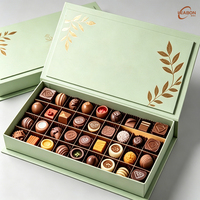 Boîte pliante style livre avec gaufrage à chaud or, emballage rigide en matériau recyclable pour chocolats, pralines et bonbons