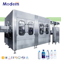 Machine de remplissage électrique d'eau minérale pour bouteilles PET Moteur PLC automatique intégrant le bouchage de remplissage de lavage pour produits chimiques