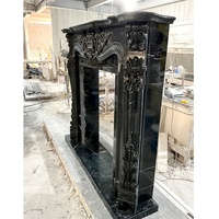 Cheminée en marbre noir de conception moderne sculptée à la main pour la décoration intérieure