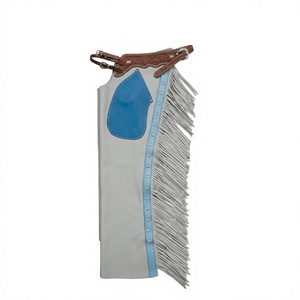 Pantalones de cuero personalizados estilo western para rodeo, de cuero liso gris, decorados con borlas de gamuza azul, de cintura alta, sin mangas y con bolsillos. - Product Image 1