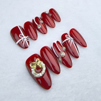 El arte de uñas portátil hecho a mano puro estilo navideño festivo rojo se puede reutilizar
