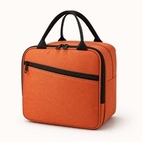 Sac isotherme pour repas de bureau avec poche avant zippée et poignées compactes dans un porte-repas fin orange