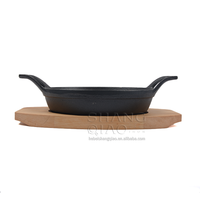 Vente de gros Plat à gratin rond en fonte Assiette Fajita avec socle en bois