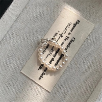 Elastische Y2K weibliche koreanische INS Bogen Fingerring Trendy Kunststoff Cluster Ringe mit Perle Perlen Cluster
