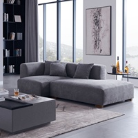 Canapé modulaire en tissu capitonné en forme de L, design populaire, avec housse amovible pour villa et atelier
