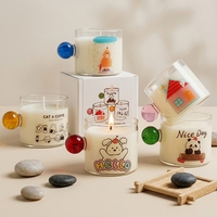 Bougie en verre mignonne de style dessin animé avec poignée colorée, bougies parfumées en cire de soja faites à la main pour la décoration de la maison, coffret cadeau en gros