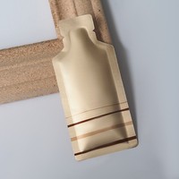 Nouveau design de sac distributeur de miel en forme de bouteille en aluminium sac sachet de gel énergie fruits sac d'échantillon cosmétique portable