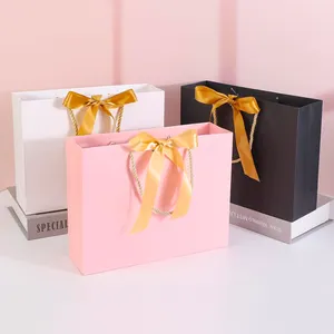 High Quality Pink Clothing Shopping Luxury Brand Customized Gold Foil Logo Organza Ribbons Jewelry Carrier Paper Bags
