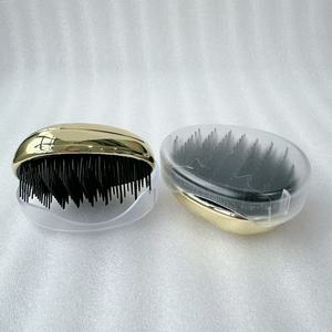 Cepillo de pelo en forma de huevo Peine desenredante de plástico Cabeza Masaje del cuero cabelludo Peine Salón Ducha Herramientas de peinado - Product Image 3