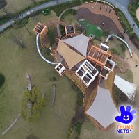 Aire de jeux modulaire extérieure avec structure métallique, toboggan tubulaire, tour d'escalade, pont en maille, équipement de parc pour enfants commercial, conception personnalisée OEM