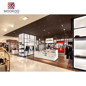 时尚现代精品服装店家具与衣服展示架和柜台和桌子的服装零售店