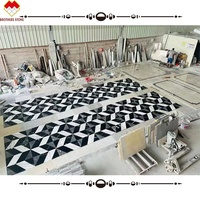 Carreaux de sol en marbre moderne avec incrustation de marbre noir assorti blanc pur personnalisé, motif de jet d'eau