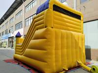 Château gonflable commercial jaune avec toboggan, structure de saut pour enfants, idéal pour la location événementielle