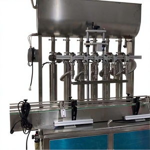 Máquina de llenado al vacío de líquido de agua mineral de vinagre de vino de seguimiento de botellas de vidrio para Malta con transportador - Product Image 1