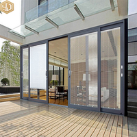Porte coulissante en verre en alliage d'aluminium au design moderne avec moustiquaire coupe-vent, surface finie pour usage hôtelier, vente en gros