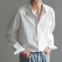 Camisa de hombre de manga larga estilo coreano, moderna y elegante, de corte holgado, color liso, sin arrugas, con cuentas, para otoño.