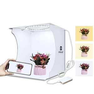 Prix d'usine PULUZ avec 2 panneaux LED, mini <span class=keywords><strong>studio</strong></span> photo <span class=keywords><strong>pliable</strong></span>, <span class=keywords><strong>fond</strong></span> <span class=keywords><strong>noir</strong></span> <span class=keywords><strong>et</strong></span> <span class=keywords><strong>blanc</strong></span>, kit de <span class=keywords><strong>studio</strong></span> photo avec lumière 1100LM - Product Image 1