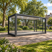 Serre en verre préfabriquée, pièce de jardin modulaire avec structure en acier et murs vitrés pour usage extérieur