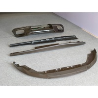 Kit carrosserie en fibre de carbone sèche style OEM (lame avant, diffuseur arrière, jupes latérales) compatible avec Ferrari Roma