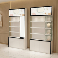 Vitrine de présentation verticale de luxe pour bijoux, cadre en métal noir, verre transparent, éclairage LED, étagères, armoire blanche avec serrure et clé