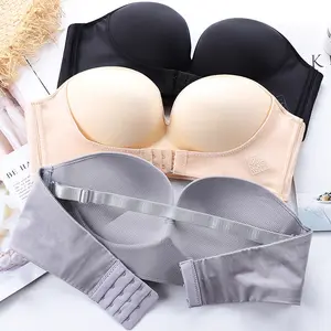 Top de tubo personalizado QQT #, gran oferta, sujetador de realce sin tirantes con botones en la parte delantera antideslizante pegado en el pecho para mujer