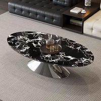 Table basse ovale moderne en marbre, petite et simple, idéale pour salon design familial