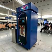 Distributeur d'eau en libre-service avec écran défilant, acceptant les paiements par carte IC, pièces, code QR et carte de crédit.