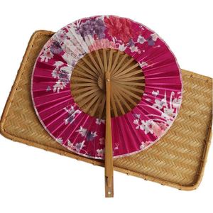 Éventail pliant vintage en bambou pour femme, motif fleur de cerisier sculpté, avec pompon en tissu teinté, élégance raffinée et artisanale - Product Image 3