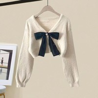 Ensemble pull et jupe taille haute décontracté pour femme, style automne, avec nœud, manches bouffantes, col en V, boutonnage simple, couleur unie, 100 % polyester, vente en gros