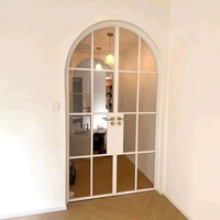 Porte intérieure à double battant en verre avec design arqué et cadre en alliage de titane