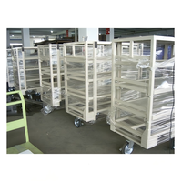 Chariot d'entrepôt métallique personnalisé à étagères multi-niveaux en maille, chariot de transport logistique avec roulettes pour la manutention de marchandises et colis