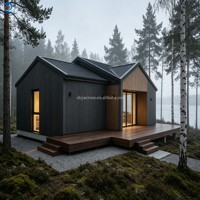Maison de luxe style Forêt Nordique, 3 chambres, 2 salles de bain, bardage foncé, revêtement en acier, toit en métal à double pignon, portes coulissantes, terrasse en L, vue sur le lac, clé en main