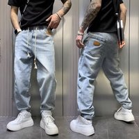 Jeans noirs baggy personnalisés pour hommes, taille mi-haute, style hip-hop, en denim.