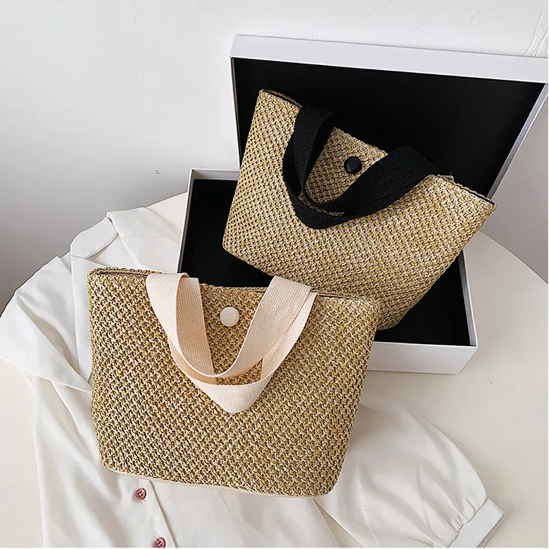 Elegante nuova borsa a tracolla da spiaggia in paglia con manico in bianco e nero di design all'ingrosso borse tote bag di moda per le donne