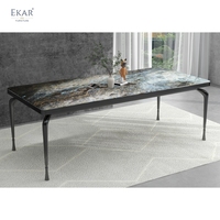 Table à manger ronde moderne, surface aspect pierre grise, base cylindrique superposée pour salle à manger