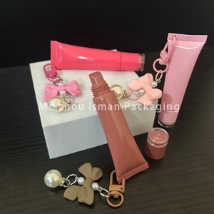 ISMAN Venta al por mayor Tubo de brillo labial exprimible de 15ml con orificio para llavero, envase vacío para esencia labial en tonos marrón y rosa, para colgante de lazo y cuentas - Product Image 2