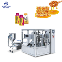 Machine automatique rotative d'emballage, d'étiquetage et de remplissage pour sachets Doypack, sachets stand-up, sachets en film métallisé/papier, sachets à haute productivité pour aliments, miel, bâtonnets et liquides
