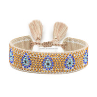 2025 haute qualité exquis estampillé à chaud étincelant strass artisanat tissé personnalisable diable yeux broderie gland Bracelet
