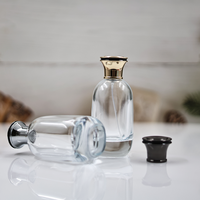 Vente en gros de bouteille de parfum plate en verre de 100ml couvercle en alliage de zinc boîte-cadeau personnalisée diffuseur sérigraphie manipulation de surface de gel